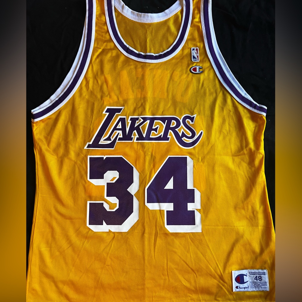 Brand new Lakers Shaquille O’Neal jersey, size 48.  Made by Champion.